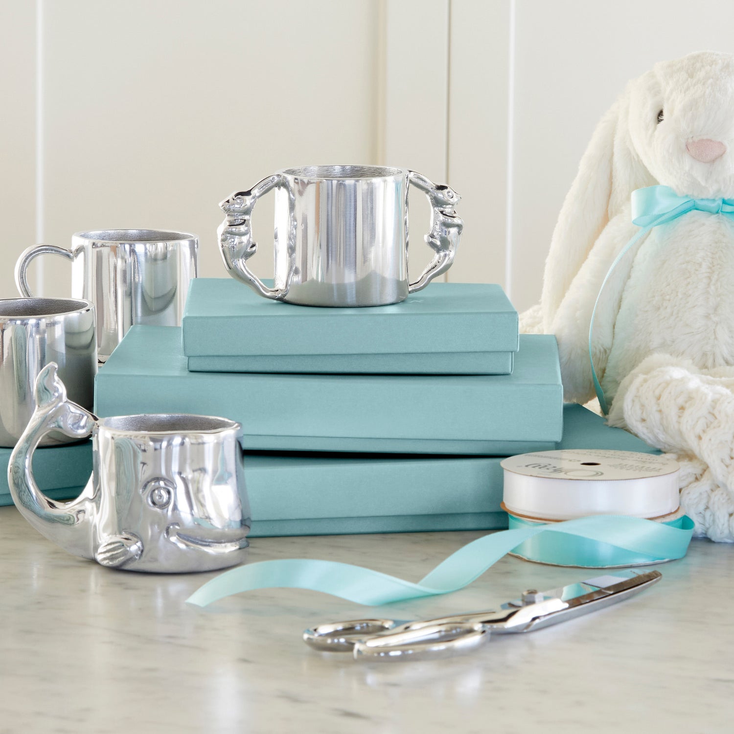 silver baby gifts - silver baby cups, ribbon, scissors and white bunny