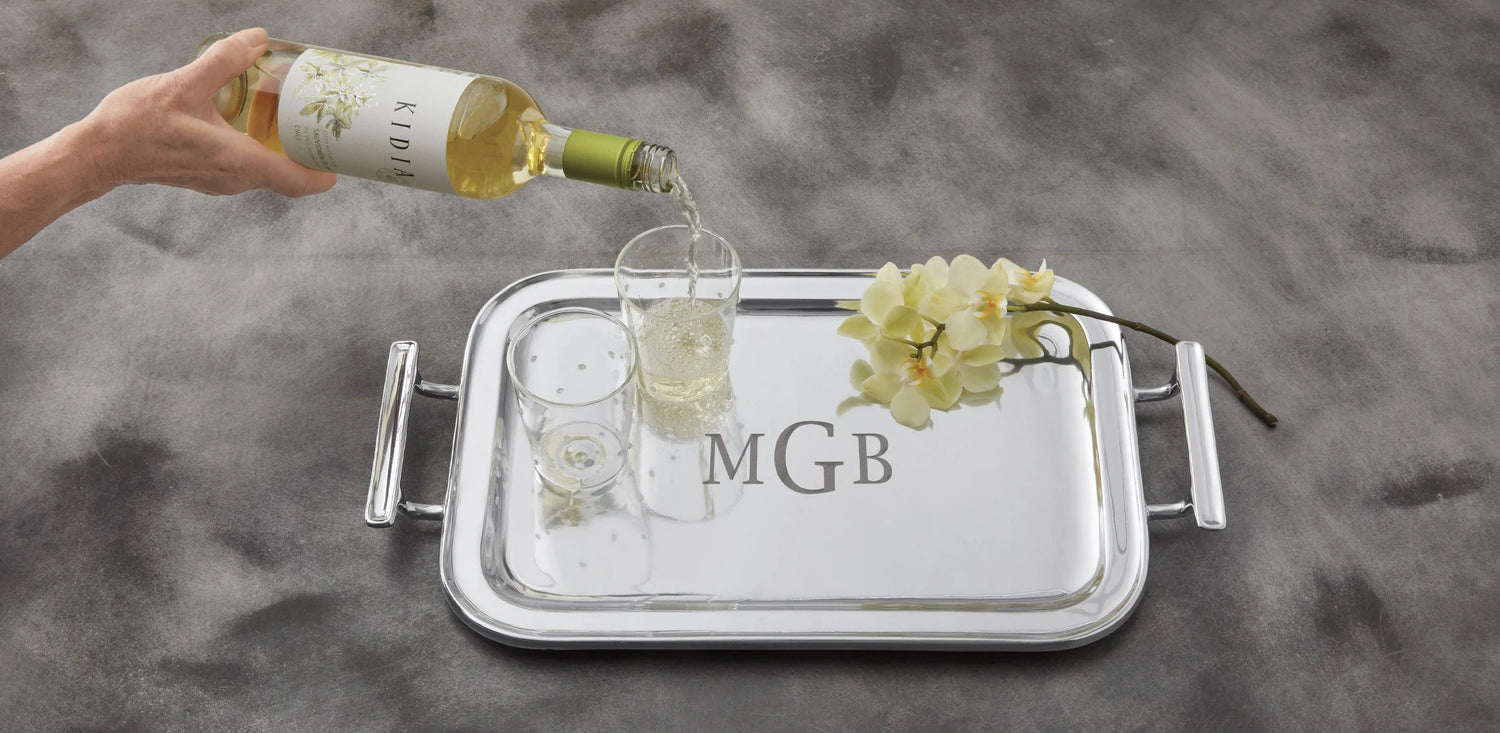 engraved silver serving tray with 2 glasses and wine
