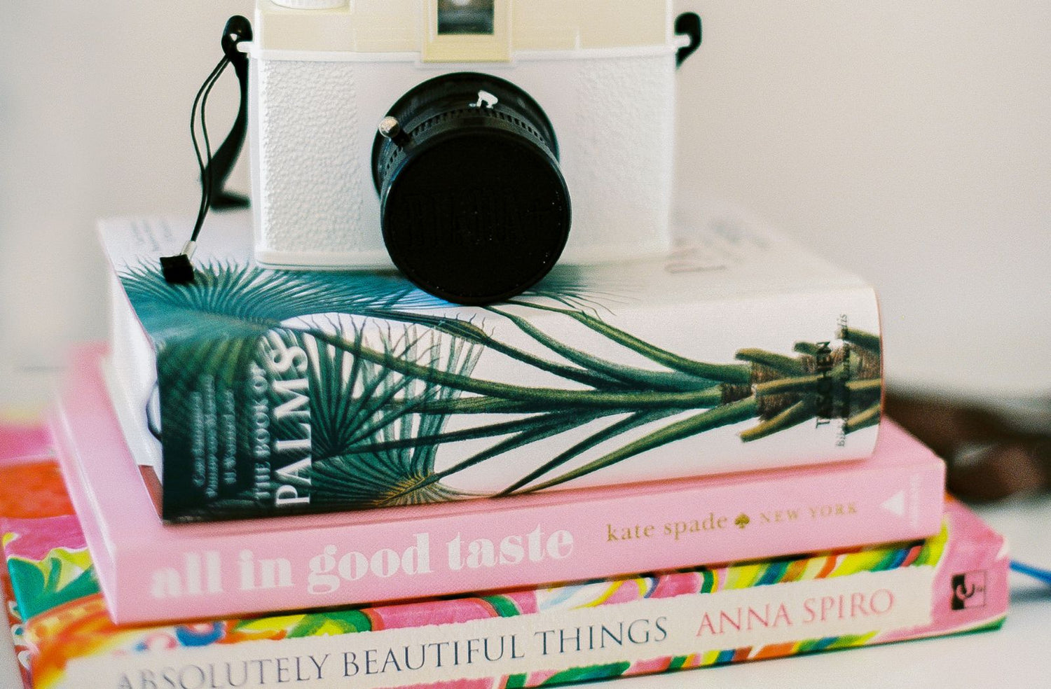 camera on top of books