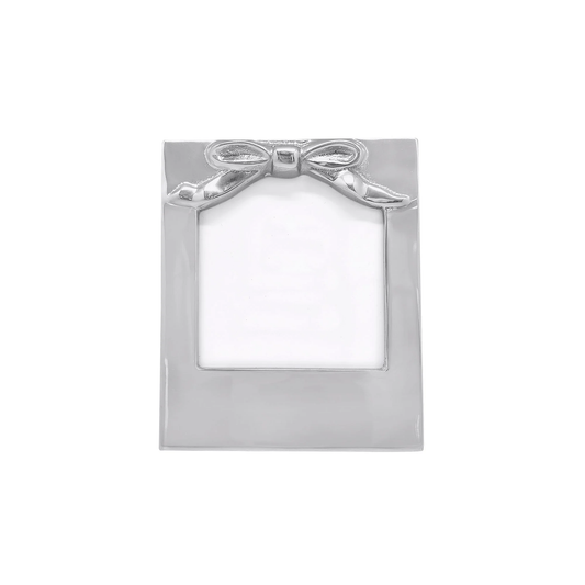 Silver picture frame with a bow design on a white background